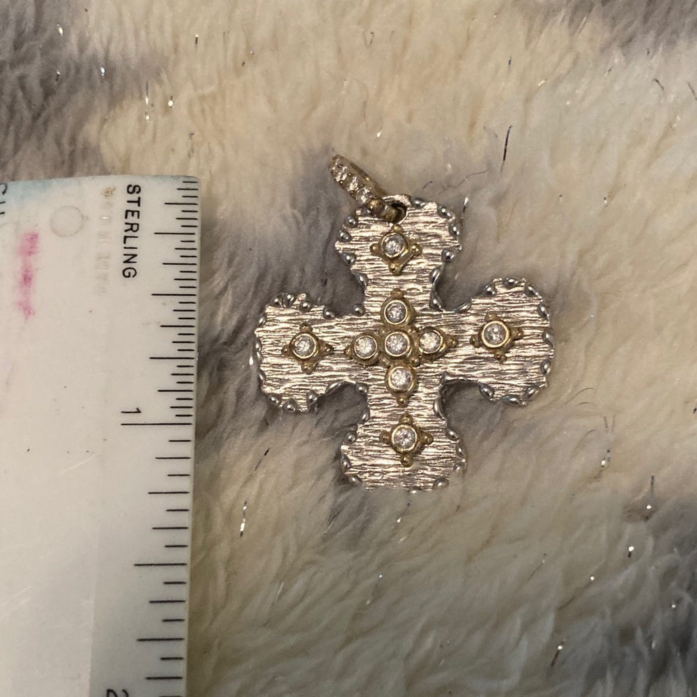 Elegant sterling silver and gold textured cross pendant with sparkling accents. - Picture 2 of 4